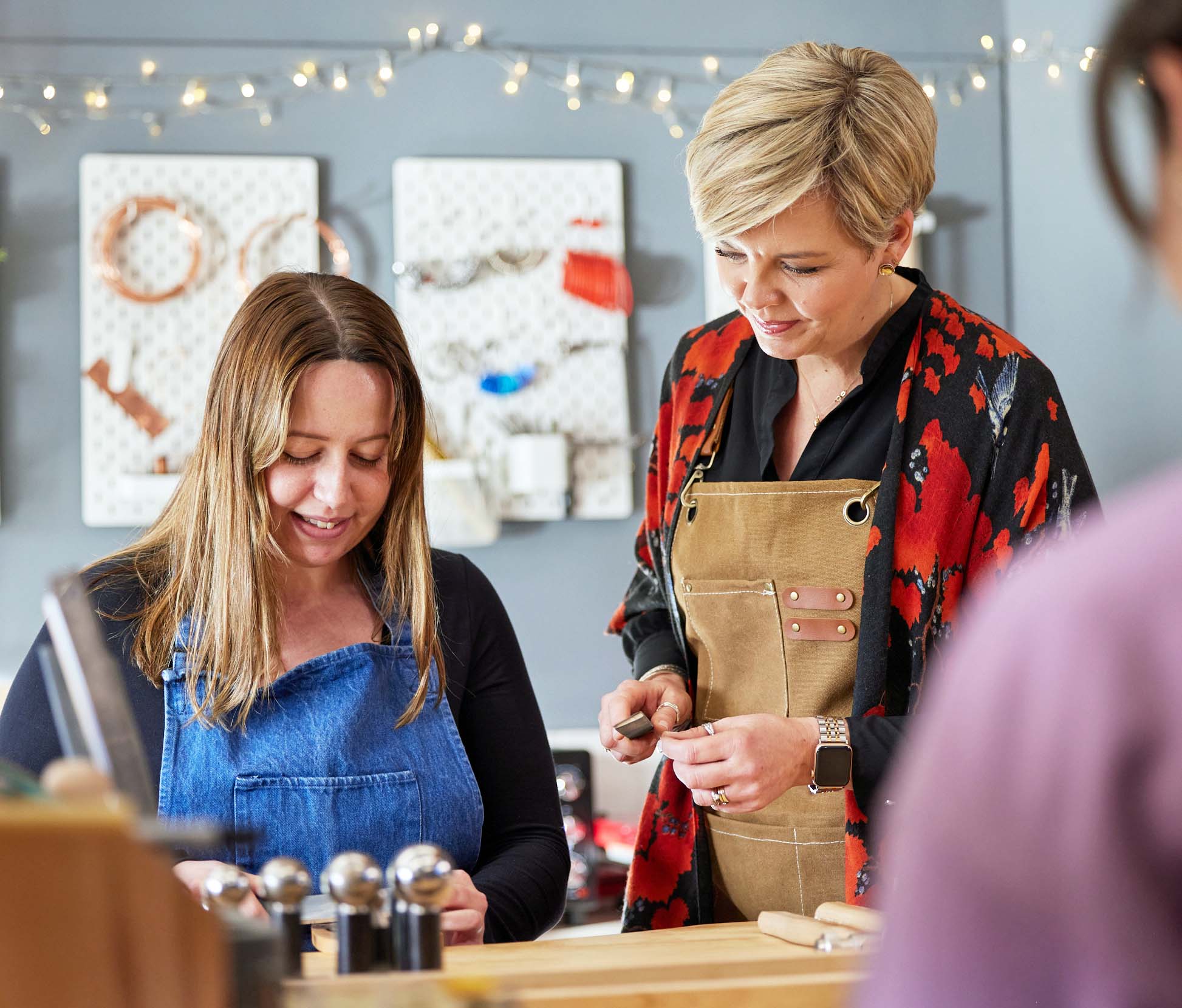 Maggie Read teaching a student how to make jewellery