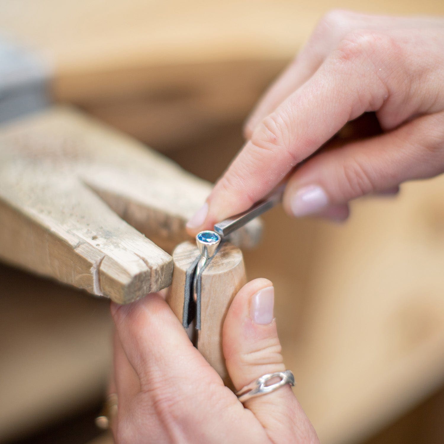 Close up of a stone being set into a silver ring by Maggie Read Jewellery