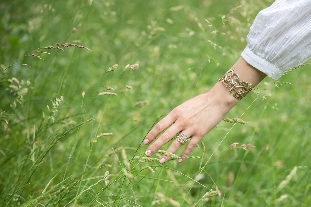 Handmade brass cuff from the molten metal collection by Maggie Read Jewellery